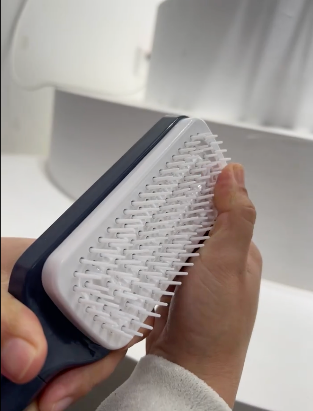 Self-Cleaning Detangler BrushTM