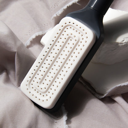 Self-Cleaning Detangler BrushTM
